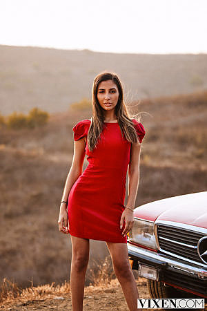 Avery Christy Poses in a Hot Red Minidress on a Car