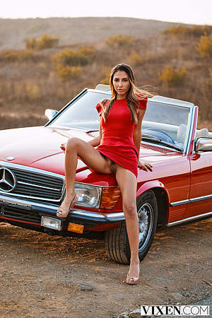 Avery Christy Poses in a Hot Red Minidress on a Car